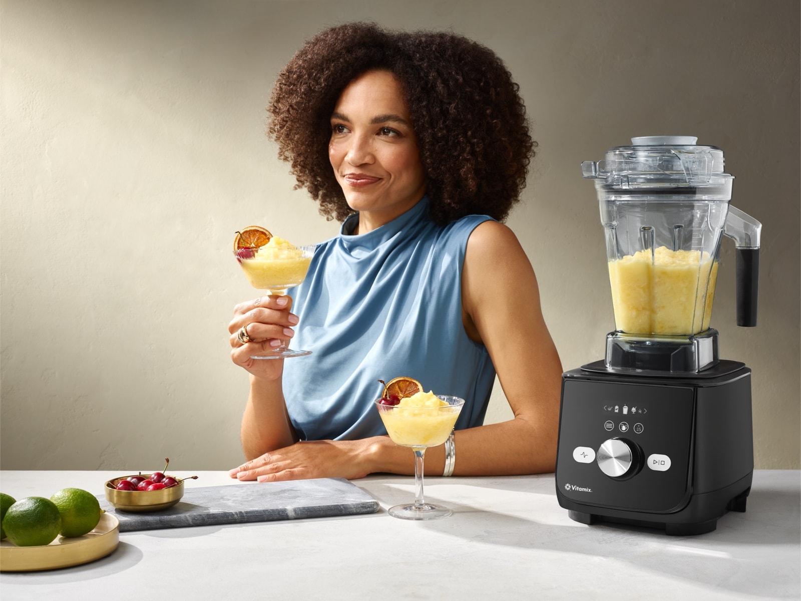 Image of Woman Next to AscentX 5 Blender