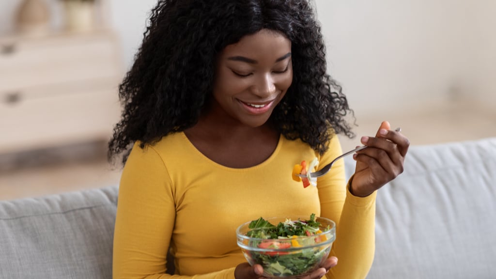 Image of Pregnant Woman Eating Salad